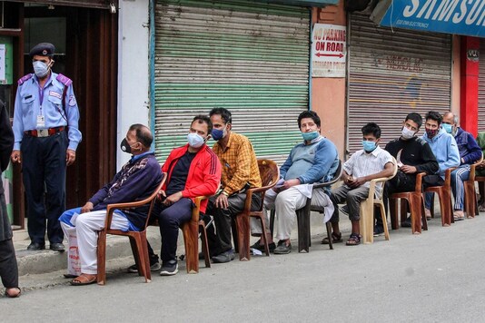 Citizens wait to enter a bank during COVID-induced lockdown in Srinagar, Wednesday, May 5, 2021. (PTI)