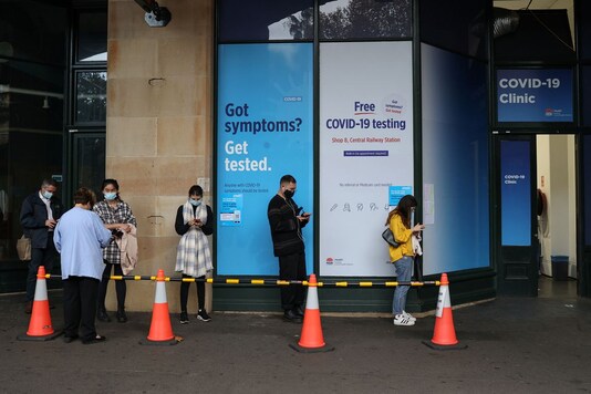 People wait outside Covid-19 testing clinic after new cases were reported in Sydney. (Reuters)