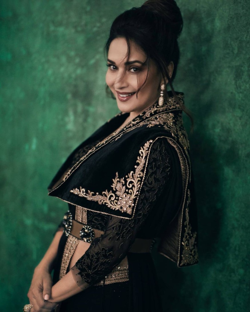  Madhuri looked no less than a goddess clad in a black sari and heavily embroidered blouse-jacket. (Image: Instagram)