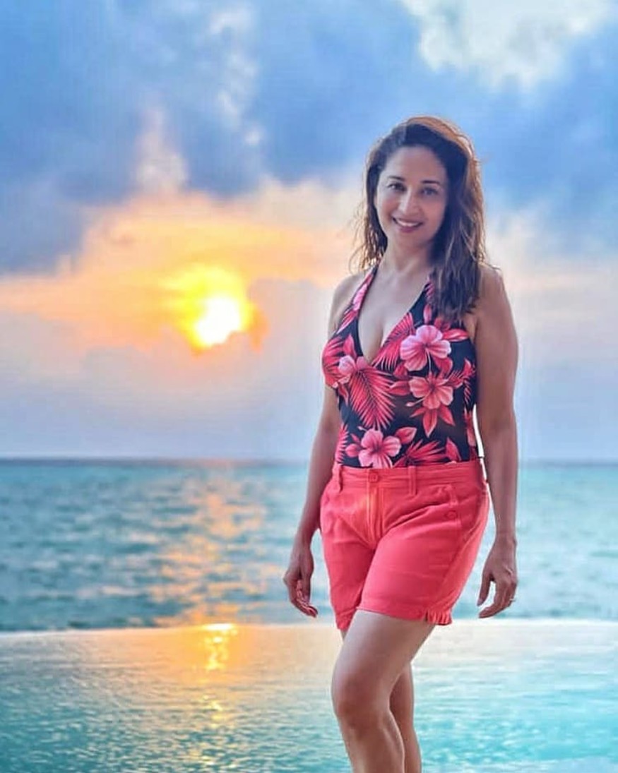  Madhuri looks fabulous flaunting her fit form in a deep plunged halter-neck top paired with matching shorts. (Image: Instagram)