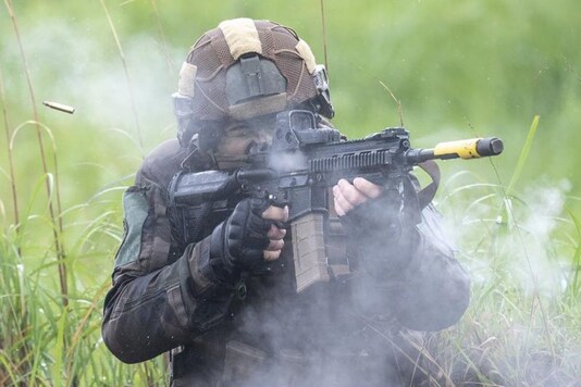 A French army soldier take part in a joint military drill between Japan Self-Defense Force, French army and U.S. Marines, at the Kirishima exercise area in Ebino, Miyazaki prefecture, southern Japan Saturday, May 15, 2021. (Charly Triballeau/Pool Photo via AP)