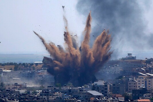 Smoke rises following Israeli airstrikes on a building in Gaza City. (AP)