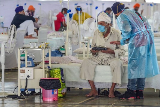 Covid-19 patients undergo treatment at Guru Tegh Bahadur COVID care centre at Gurdwara Rakab Ganj Sahib in New Delhi. (PTI)