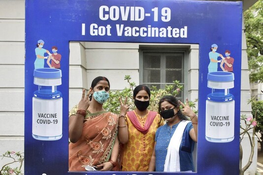 Beneficiaries pose for photographs after receiving a dose of COVID-19 vaccine in Patna. (PTI)