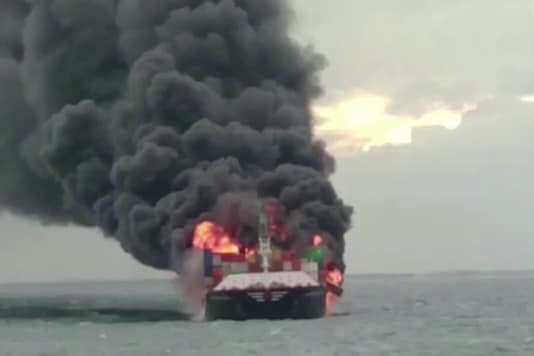 Sri Lankan authorities evacuated all crew from a vessel off its coast after a fire onboard intensified and injured two members, a spokesman for Sri Lankan Navy said on Tuesday.