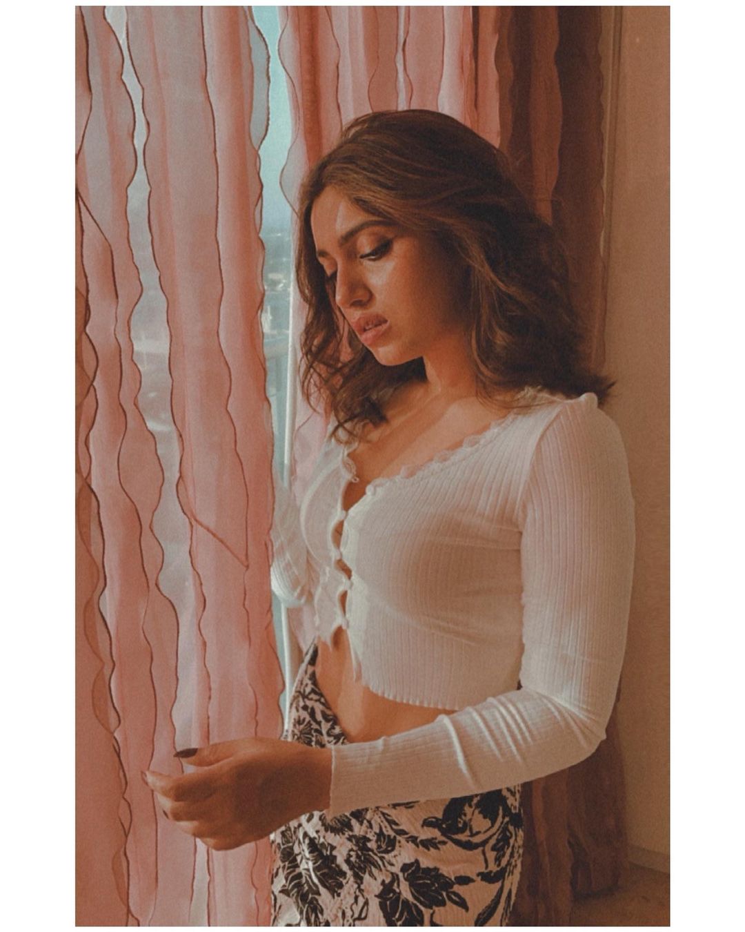  Bhumi Pednekar looks sensuous as she poses in a white crop top. (Image: Instagram)