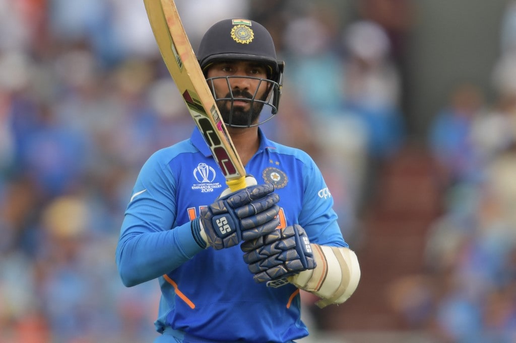 India's Dinesh Karthik leaves the pitch after losing his wicket during the 2019 Cricket World Cup first semi-final between New Zealand and India at Old Trafford in Manchester, northwest England, on July 10, 2019. (Photo by Dibyangshu Sarkar / AFP) / RESTRICTED TO EDITORIAL USE