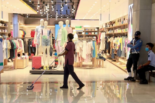 A worker cleans the floor of Ambience Mall in Gurugram. (Representational image/PTI)