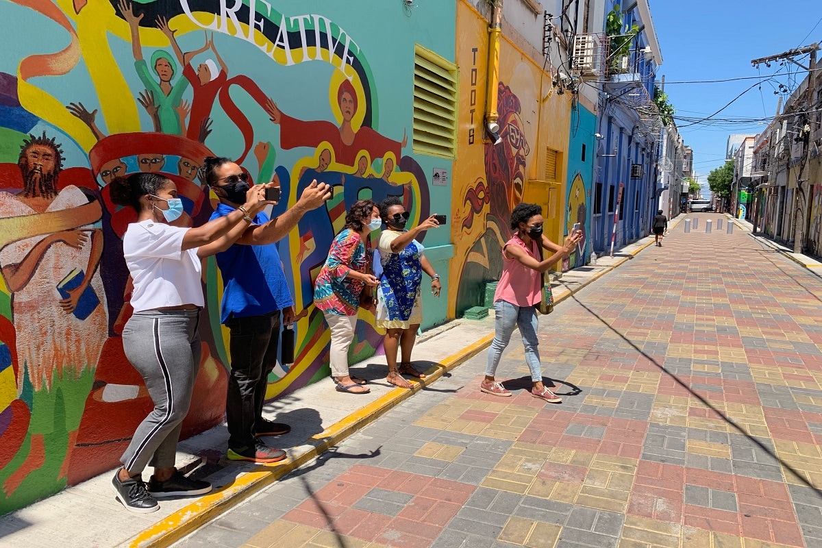 'Want to Bring Back Vibrancy' Jamaican Artists Paint Murals on Walls
