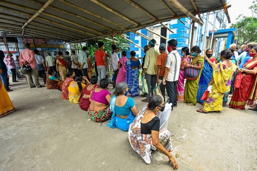 Howrah: Beneficiaries wait in a queue to receive COVID-19 vaccine dose at a vaccination camp in Howrah, Thursday, June 10, 2021. (PTI Photo)(