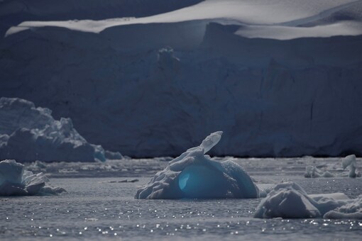 An iceberg floats along the water, close to Fournier Bay, Antarctica. (Credit:  REUTERS/Ueslei Marcelino)