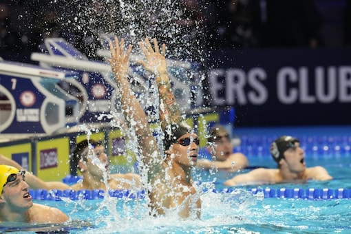 Caeleb Dressel reacts after winning the men's 100 freestyle during wave 2 of the U.S. Olympic Swim Trials  (AP)