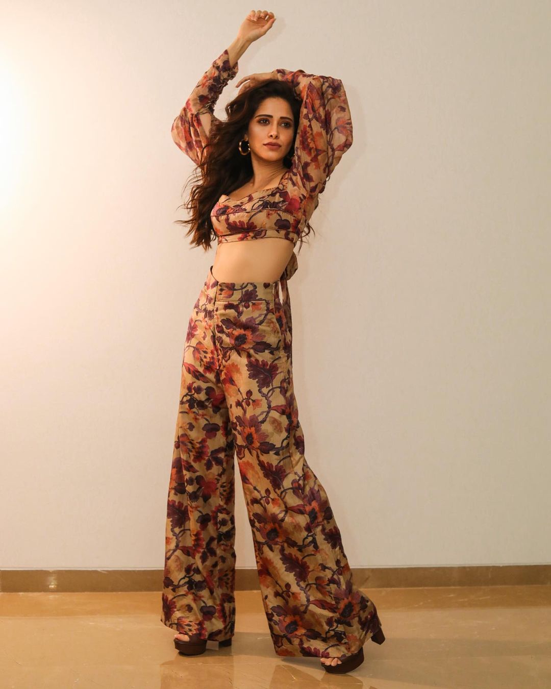  Nushrratt Bharuccha looks cool in the floral crop top and matching wide-legged pants. (Image: Instagram)