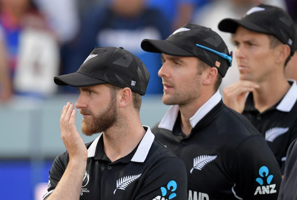 New Zealand's captain Kane Williamson (L) looks on at the trophy presentation after defeat in the 2019 Cricket World Cup final between England and New Zealand at Lord's Cricket Ground in London on July 14, 2019. - England won the World Cup for the first time as they beat New Zealand in a Super Over after a nerve-shredding final ended in a tie at Lord's on Sunday. (Photo by Dibyangshu Sarkar / AFP) / RESTRICTED TO EDITORIAL USE