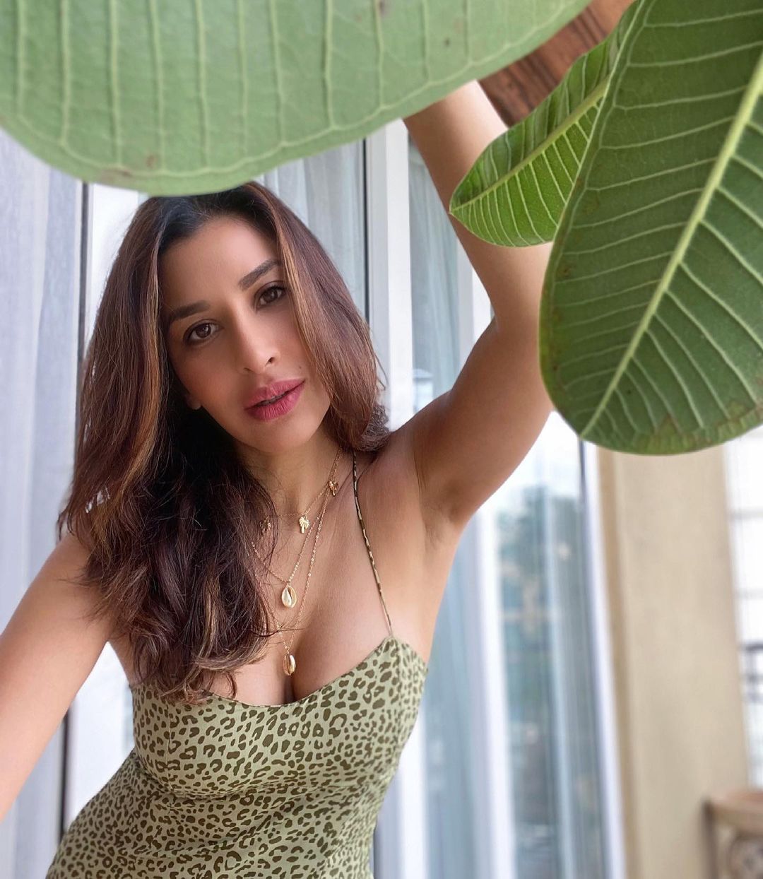  Sophie Choudry is painting a chic picture in a cheetah print slip dress. (Image: Instagram)