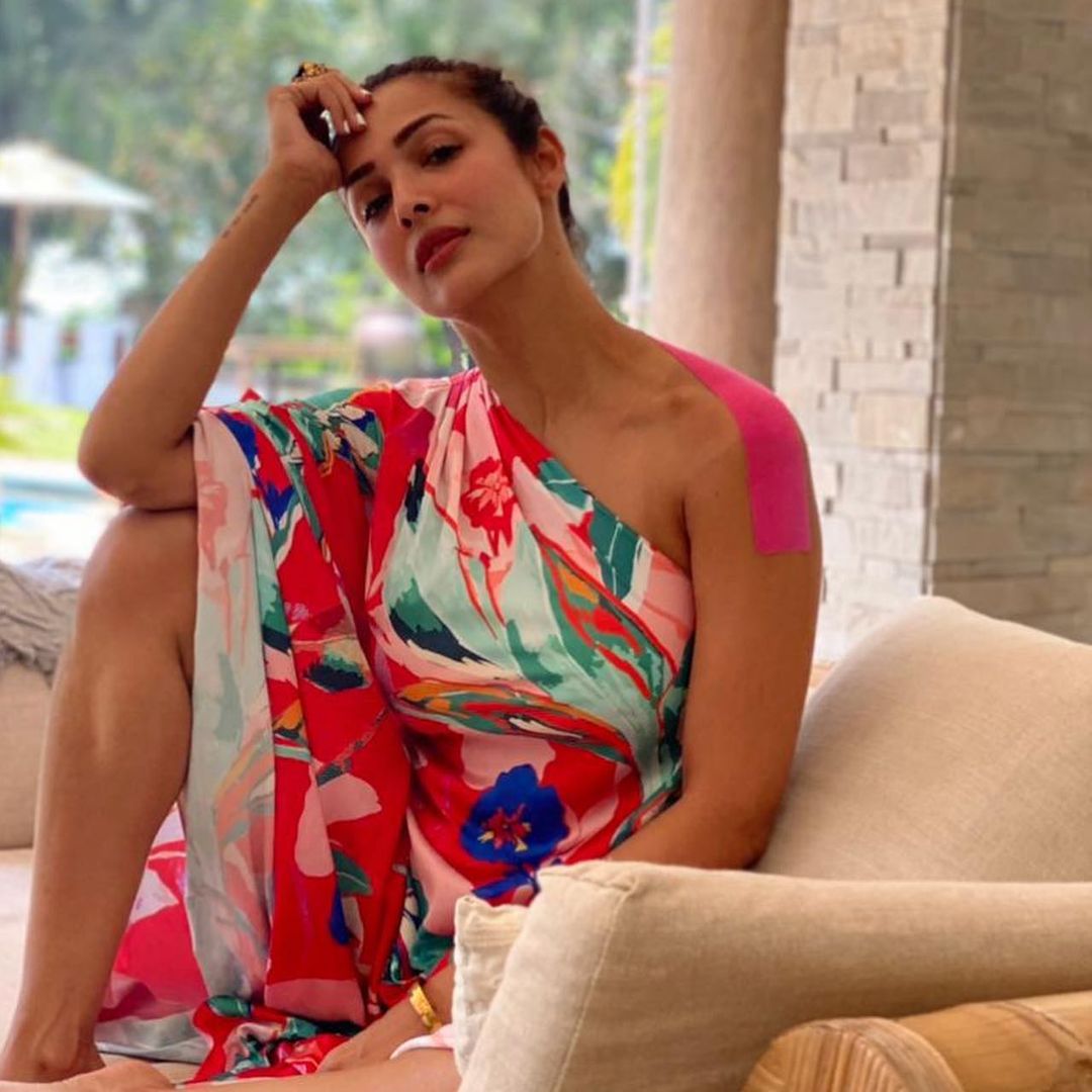  Malaika Arora keeps it sexy in the multicoloured one-shoulder dress. (Image: Instagram)