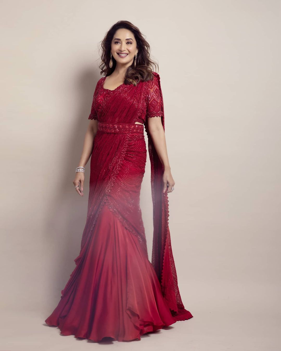 Madhuri Dixit Nene looks sexy in the deep red lehenga saree. (Image: Instagram)