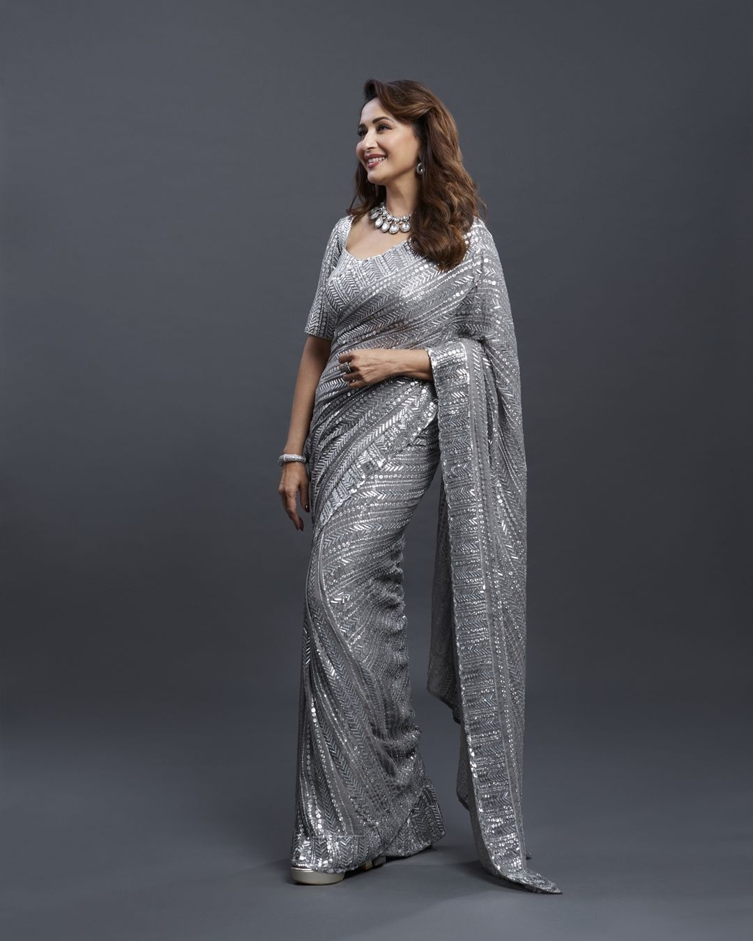 Madhuri Dixit Nene looks graceful in the sequinned silver saree. (Image: Instagram)