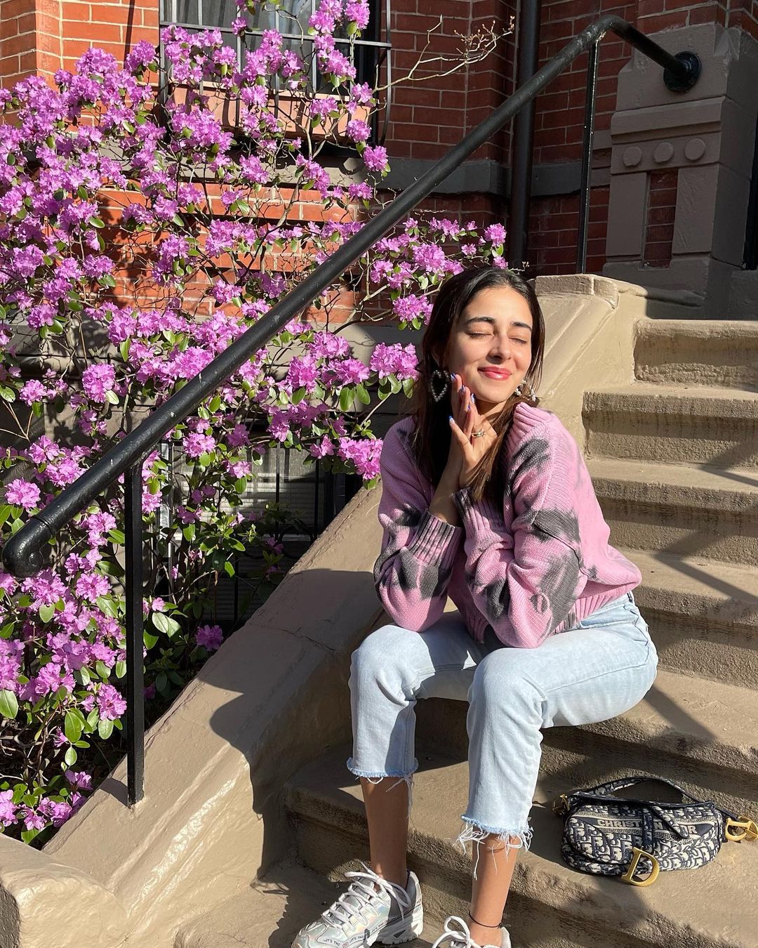  Ananya Panday experiments with her looks and keeps them interesting always. Seen here in a knitted top and ripped denims. (Image: Instagram)