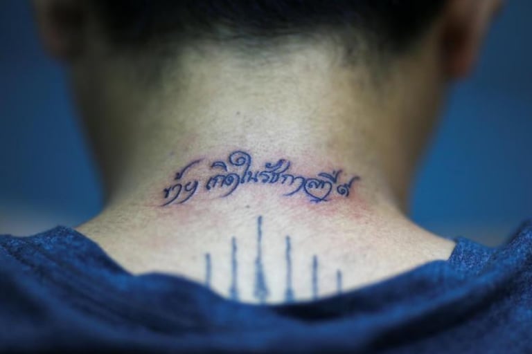 Thais turn to tattoos to remember late King Bhumibol