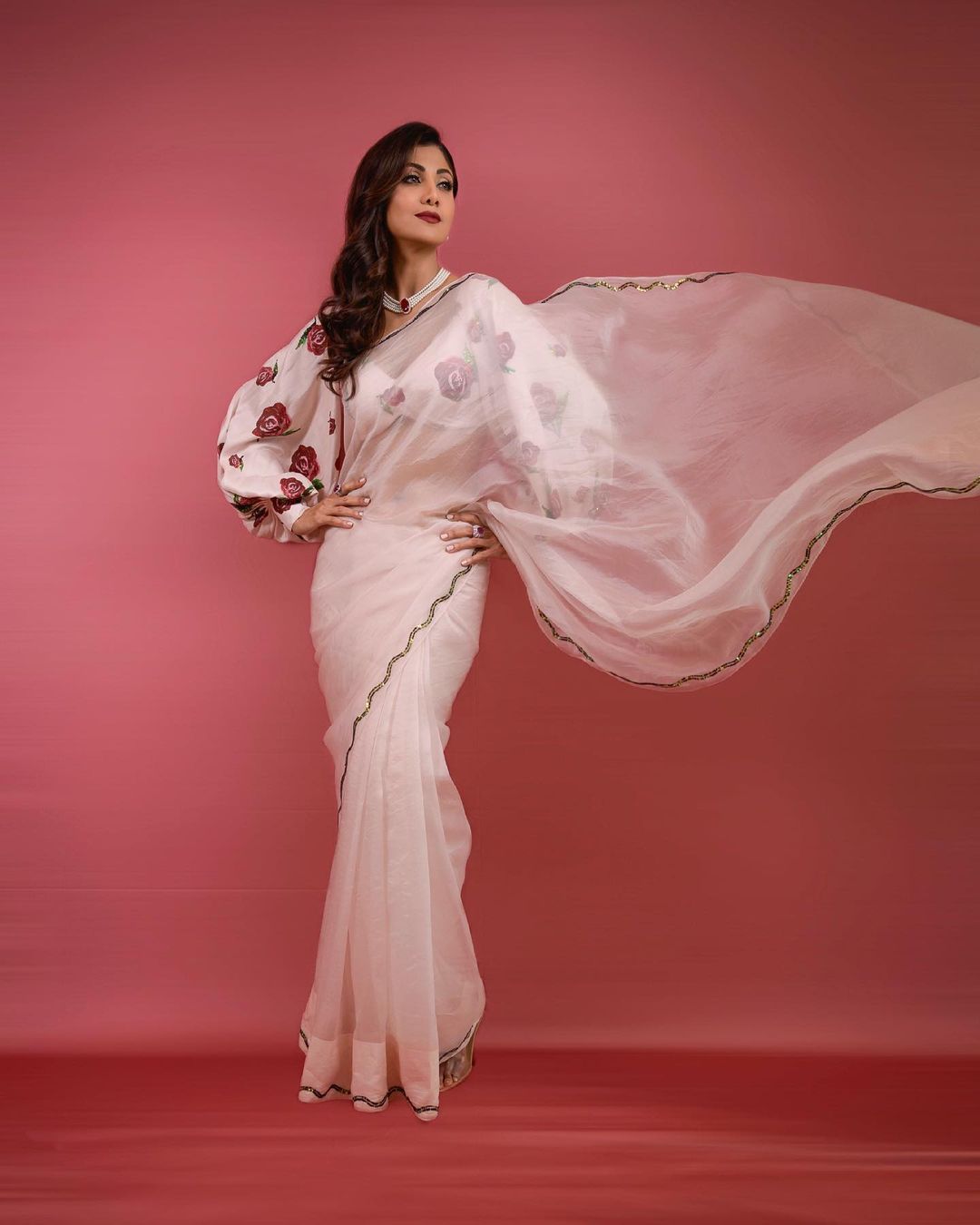 Shilpa Shetty Kundra pairs the plain semi-sheer saree with the balloon-sleeve blouse.