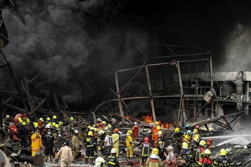 Firefighters work at the site of a massive explosion in Samut Prakan province in Thailand. (Image: AP/PTI)
