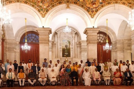 Prime Minister Modi with his new cabinet. (Image: Twitter, July 7)