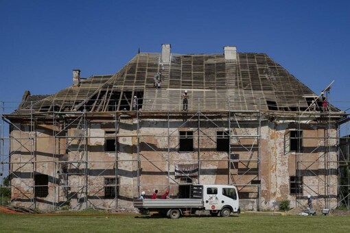 People repairing Centuries-Old-Monuments, to protect the history. (AP)