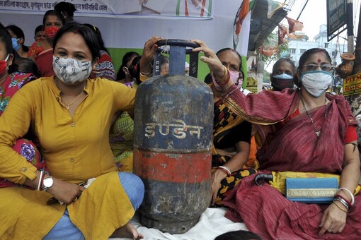 TMC activists participate in protest against fuel prices in Kolkata. (Image: PTI)