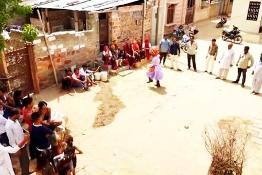 Celebrating water: villagers dance and sing on getting water connections.