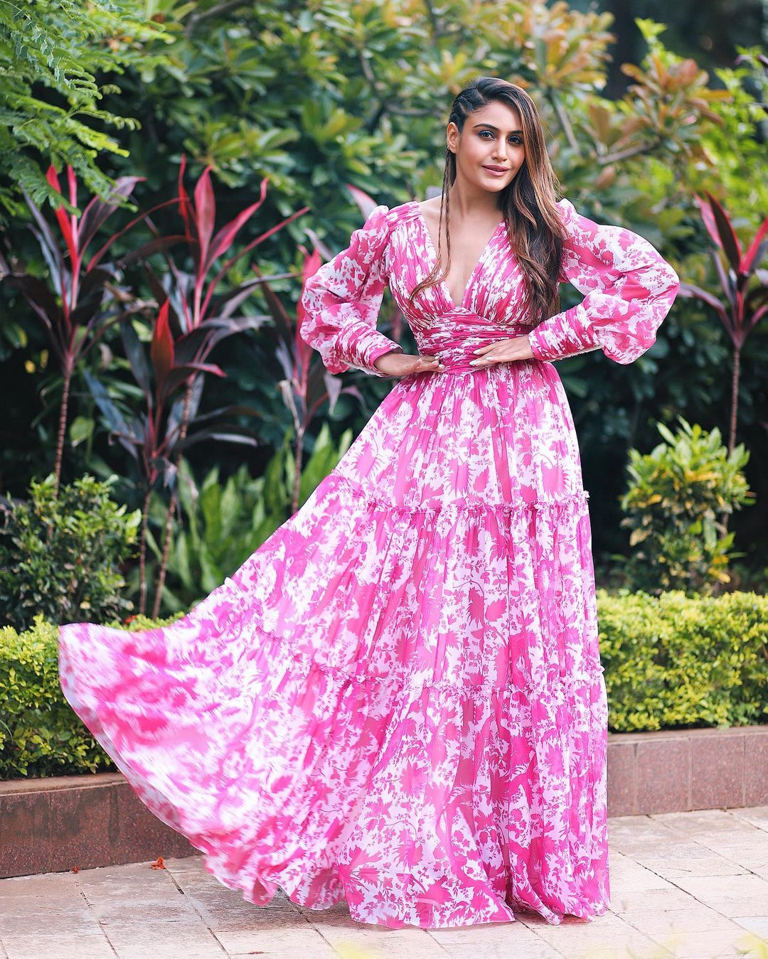  Surbhi Chandna of 'Naagin' fame took to Instagram to share pictures from her latest photoshoot. The actress can be seen in a pink floral maxi dress. (Image: Instagram)