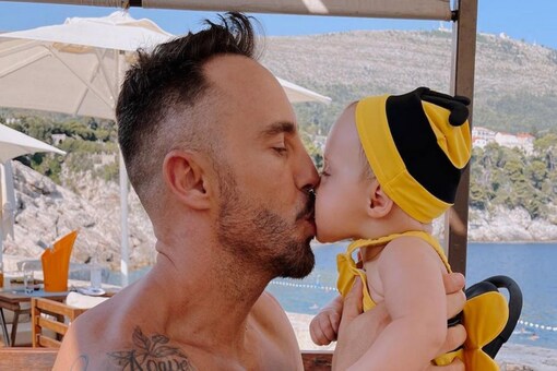 Faf du Plessis with his daughter.