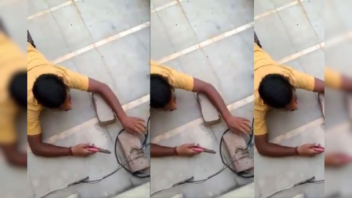 WATCH: UP Man Illegally Stealing Electricity Crawls on Floor to Cut Power Lines