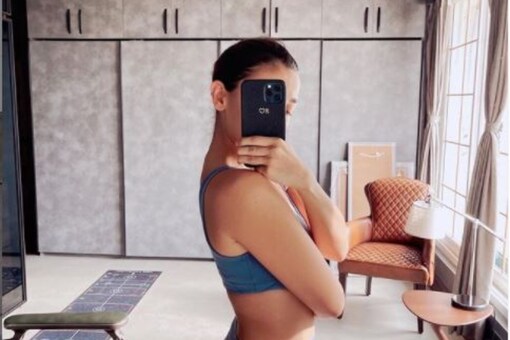 Alia Bhatt shared a post work out selfie on Instagram where she can be seen dressed in a blue sports bra and bottoms.