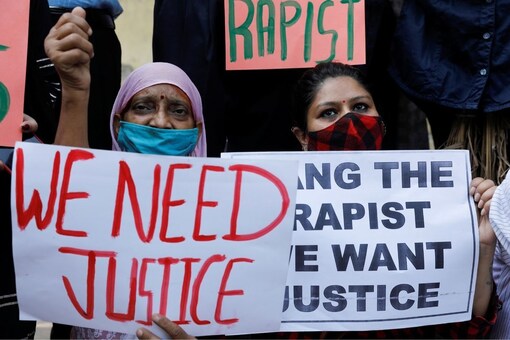 Demonstrators hold placards during a protest after the death of a rape victim in New Delhi. (Only for representation/Reuters)