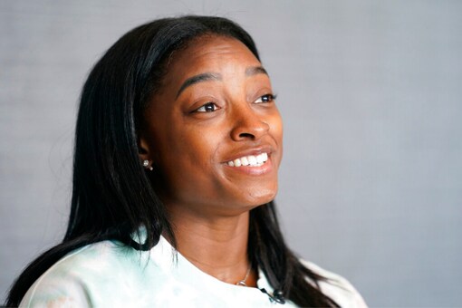 Simone Biles smiles during an interview (AP)
