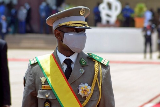 Colonel Assimi Goita, leader of two military coups and new interim president, walks during his inauguration ceremony in Bamako, Mali June 7, 2021. REUTERS/Amadou Keita
