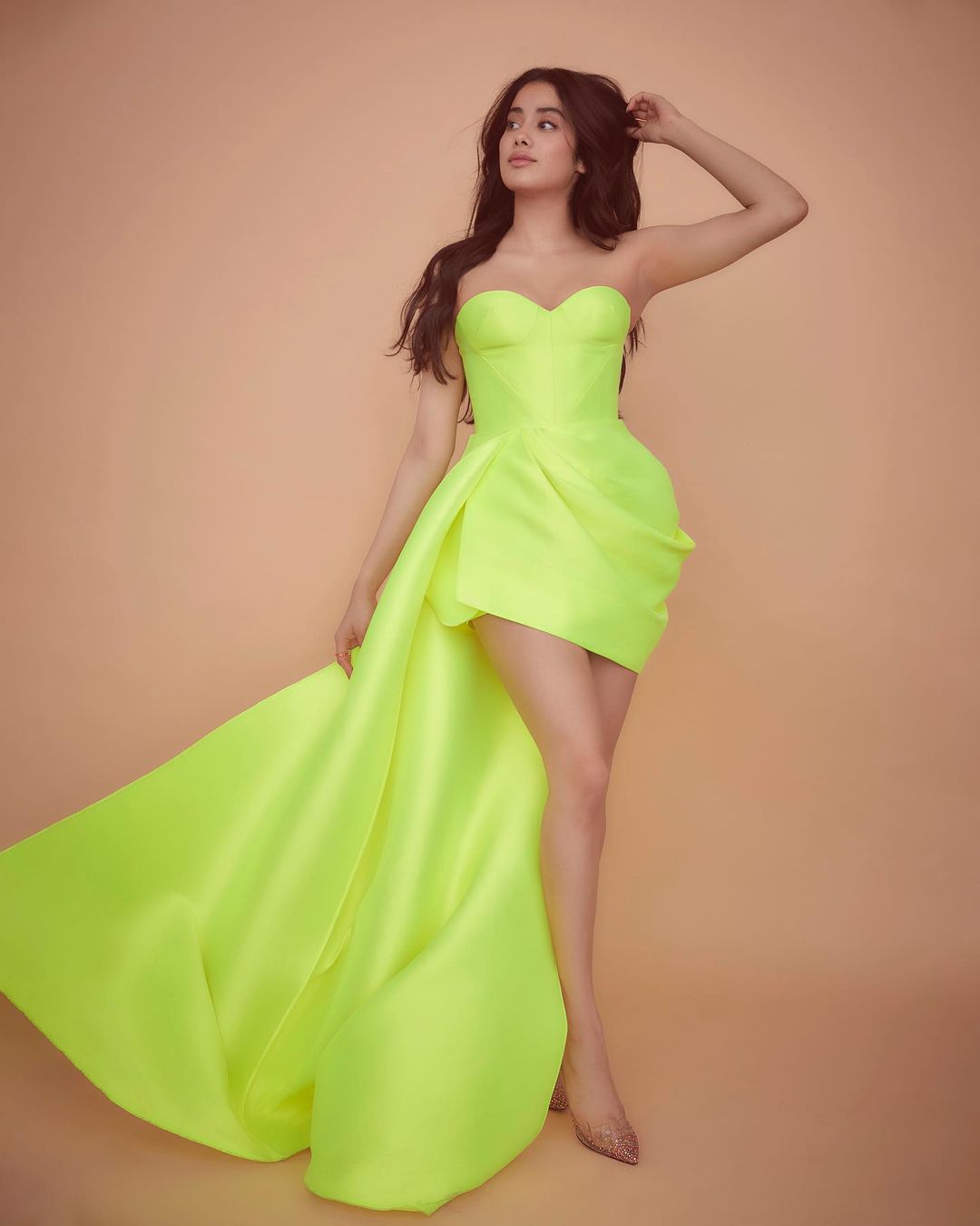 Janhvi Kapoor cuts a statusque figure in the neon green dress. 