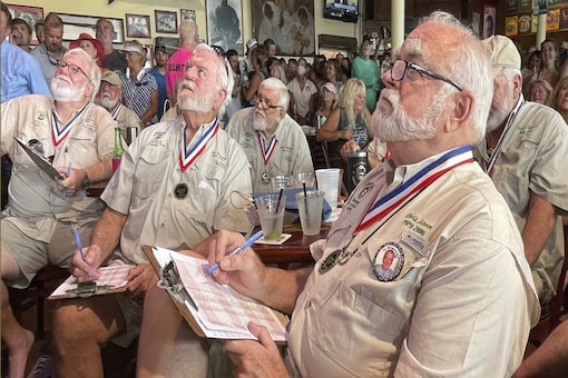 Past winners of the Hemingway lookalike contest judge this year's contestants at Sloppy Joe's Bar in Florida. (Andy Newman/Florida Keys News Bureau via AP)