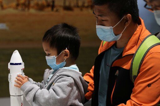 A child holds part of a rocket model at an exhibition featuring the development of China's space exploration on the country's Space Day at China Science and Technology Museum in Beijing. Reuters/File Photo