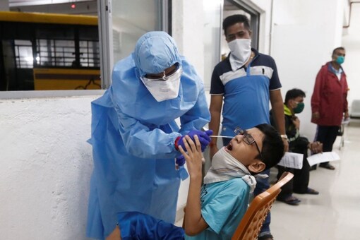 A child getting tested for Covid-19. REUTERS