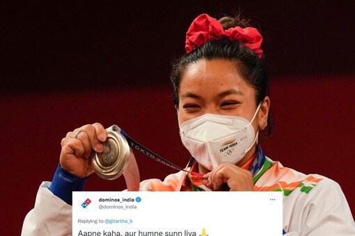 Mirabai Chanu won India's first medal at the Tokyo Olympics. (AP Photo). Screenshot of Dominoes via Twitter.