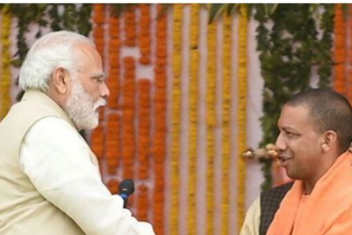PM Narendra Modi with Yogi Adityanath. (PTI File)