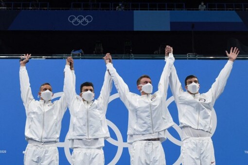Gold medallists USA's Caeleb Dressel, USA's Blake Pieroni, Bowen Becker and USA's Zach Apple stands on podium (AFP)
