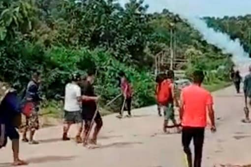 Locals during a clash with police personnel at Assam-Mizoram border at Lailapur in Cachar district on Monday (PTI Photo)