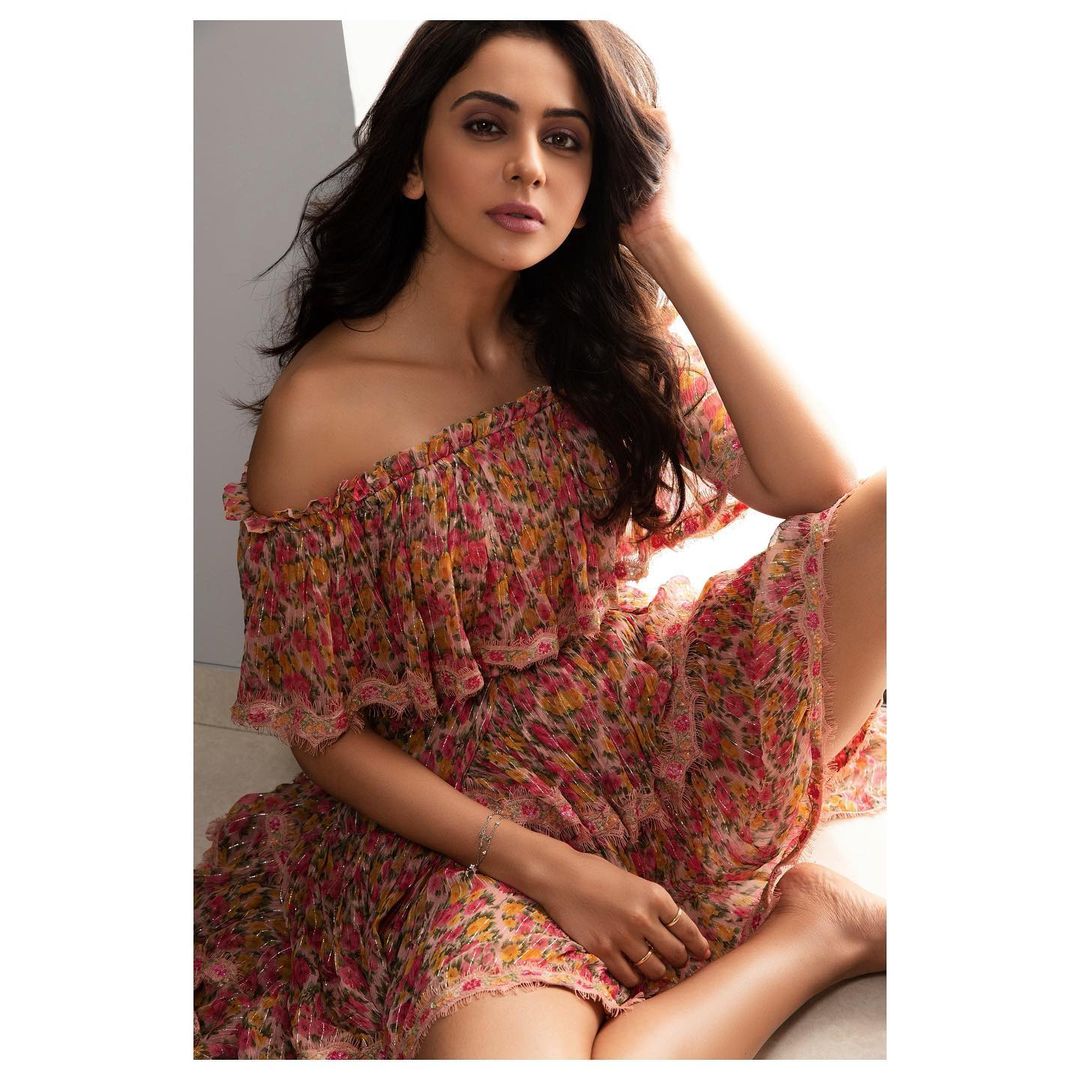 Rakul Preet Singh looks sexy in the off-shoulder printed dress. 