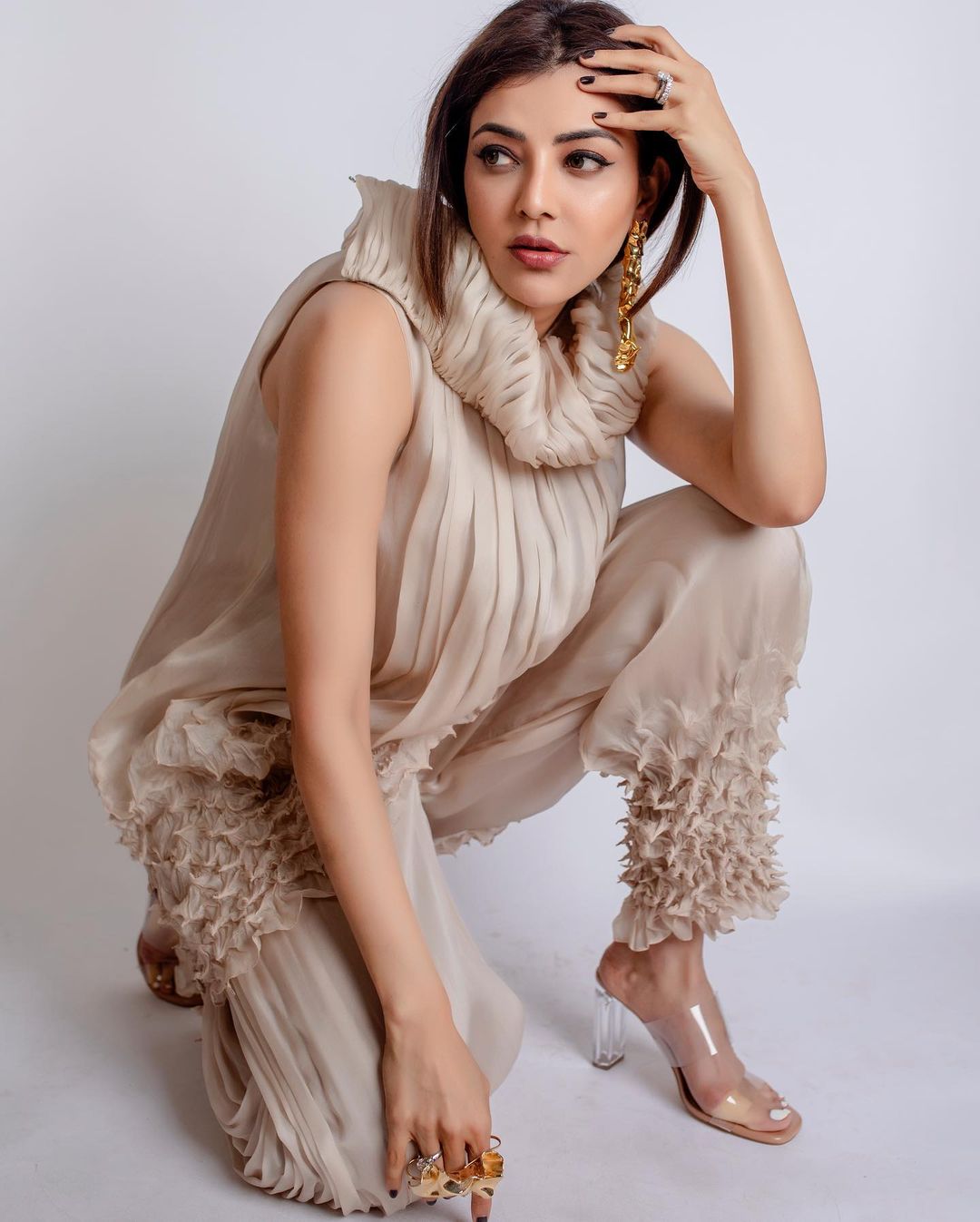Kajal Aggarwal looks sultry in the nude ensemble.