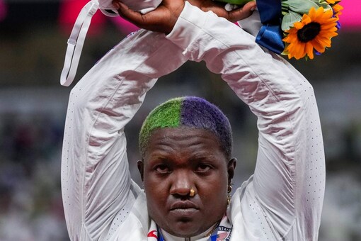 Raven Saunders of USA poses with her women's shot put silver medal (AP)
