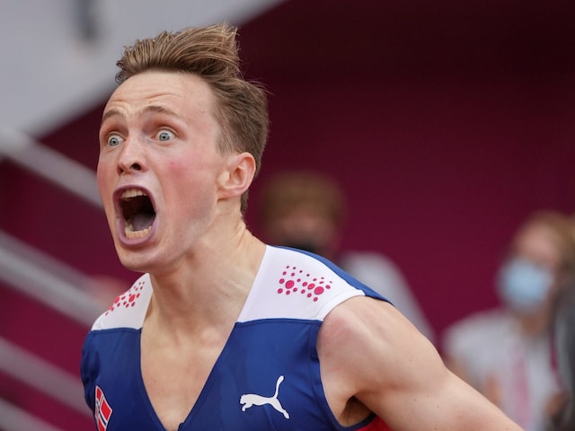 Karsten Warholm, of Norway, celebrates after winning the gold medal in the men's 400m hurdles (AP)