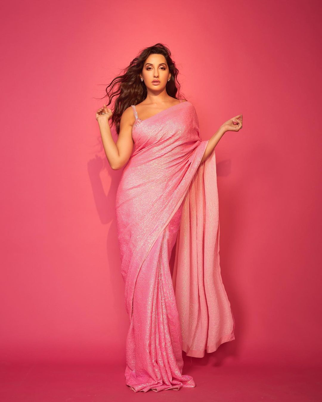 Nora Fatehi Oozes Oomph In Pink Sequinned Saree With Embellished Blouse, See Her Sultry Photos